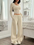 Women's long sleeve solid colour vest and pants suit in beige white polyester knit, sizes S to XL