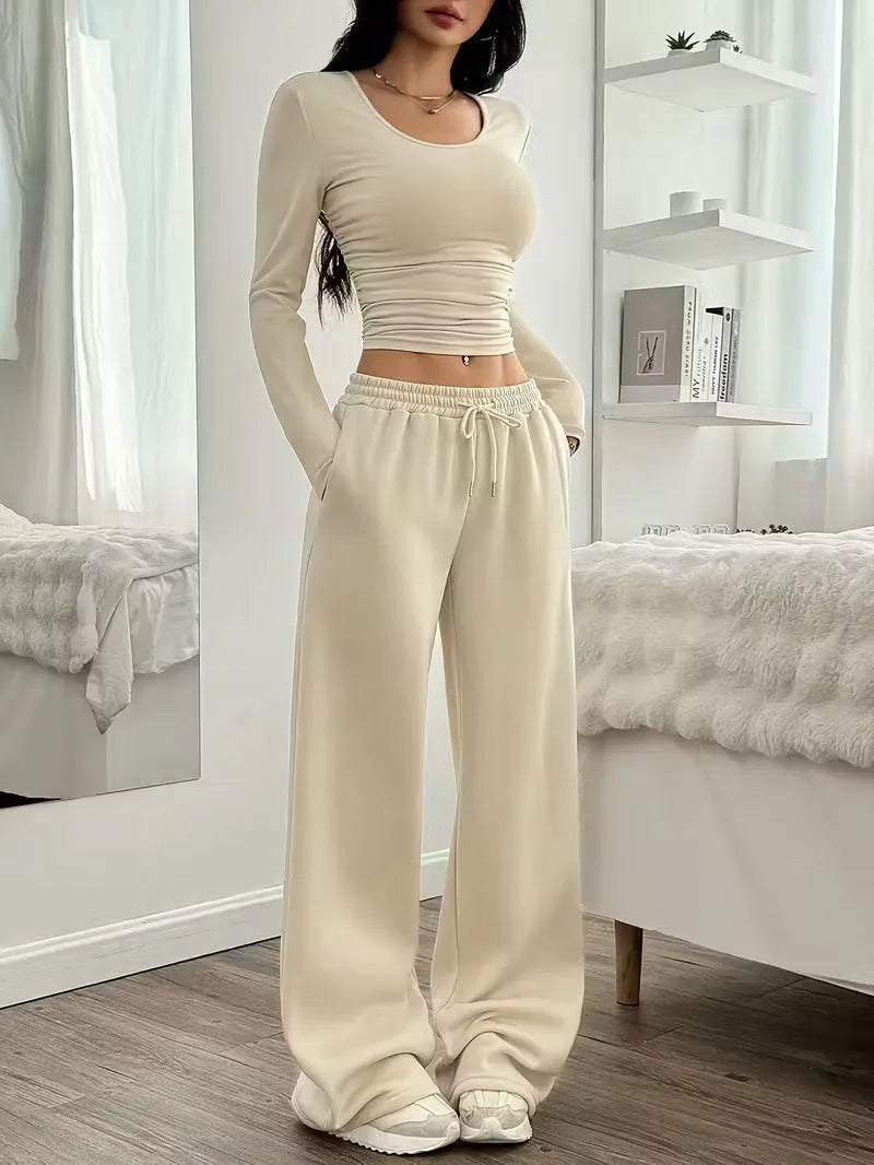 Women's long sleeve solid colour vest and pants suit in beige white polyester knit, sizes S to XL
