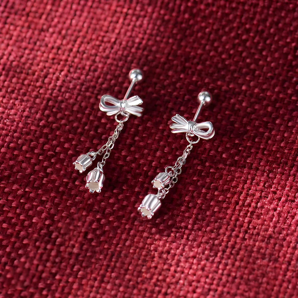 Silver bow eardrops with sweet tassel bone stud design for women