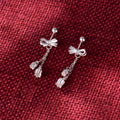 Silver bow eardrops with sweet tassel bone stud design for women