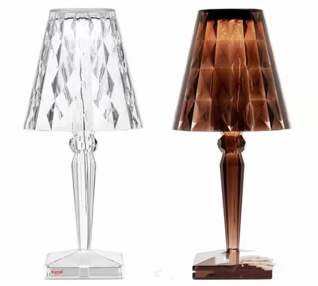 Rose gold portable touch night light on a surface showing its dimmable glow.
