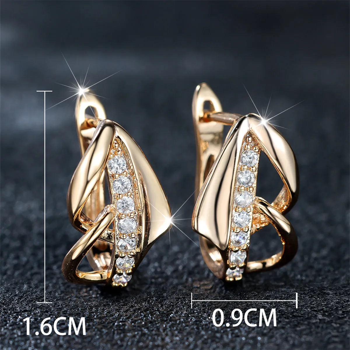 Champagne gold copper ear clip with white diamond centre, geometric arrow shape