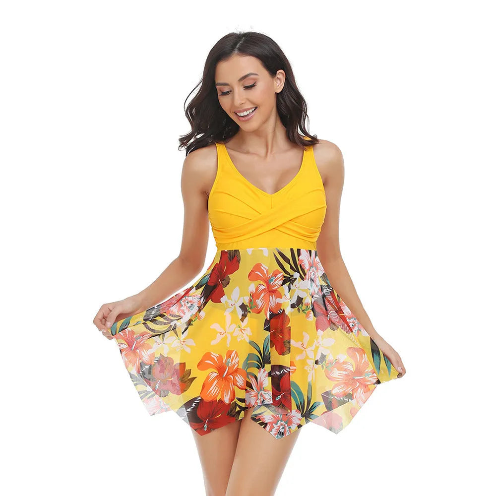 Women's one-piece swimsuit with a black detachable tulle skirt laid flat.