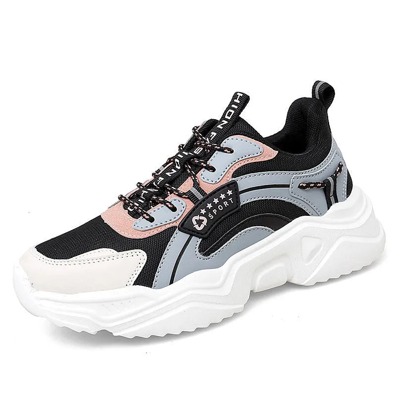 White women's casual mesh sports shoes with a thick sole, buckle detail, and round toe on a plain background.