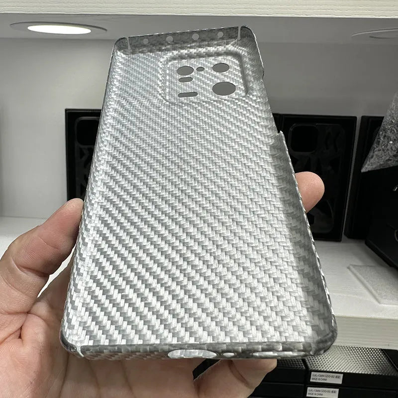 Ultra-thin 600D aramid fiber hard phone case for Xiaomi 13 and 13 Pro in matte black, bright black, or bright silver.