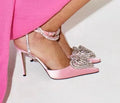 Women's pointed toe sandals with satin upper, heart-shaped rhinestones, and adjustable cross-belt straps.