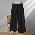 Women's straight leg casual trousers in apricot colour with an elastic waistband and lace-up drawstring detail.
