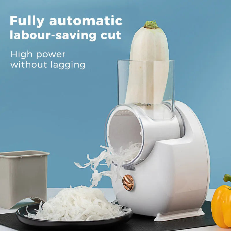 White electric vegetable slicer with rotary grater, feeding port, and multiple blade options on kitchen counter