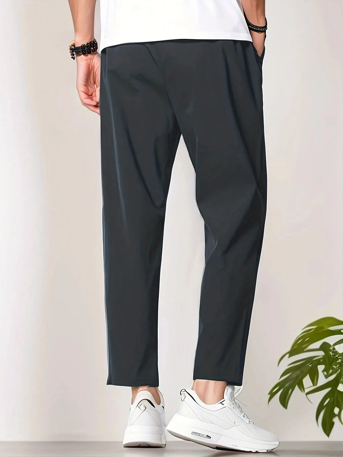 Men's slim fit ankle length trousers in black polyester, tapered leg, mid waist, cropped cut.