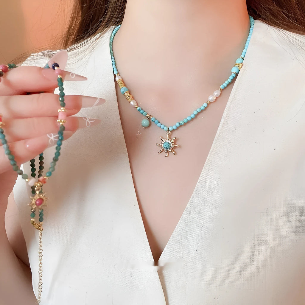 Freshwater pearl necklace with stone sun pendant on clavicle chain, blue or golden pink colour options