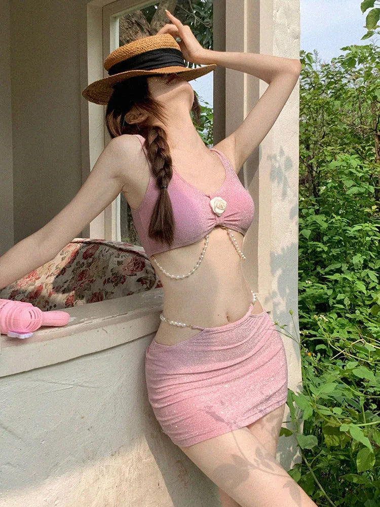 Women's three-piece bikini set in pink or black colours with briefs style and sleeveless design