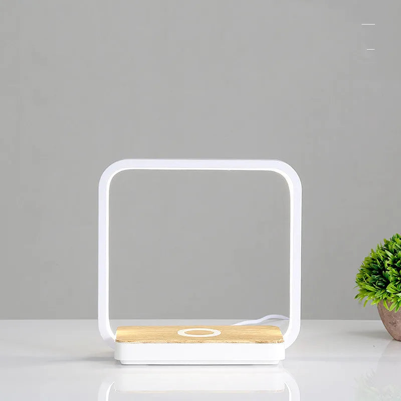 Modern table lamp with wireless charging pad for mobile phone in white finish