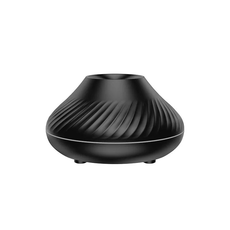 Beige USB aroma diffuser with flame-effect mist and colour-changing night light on a wooden table.