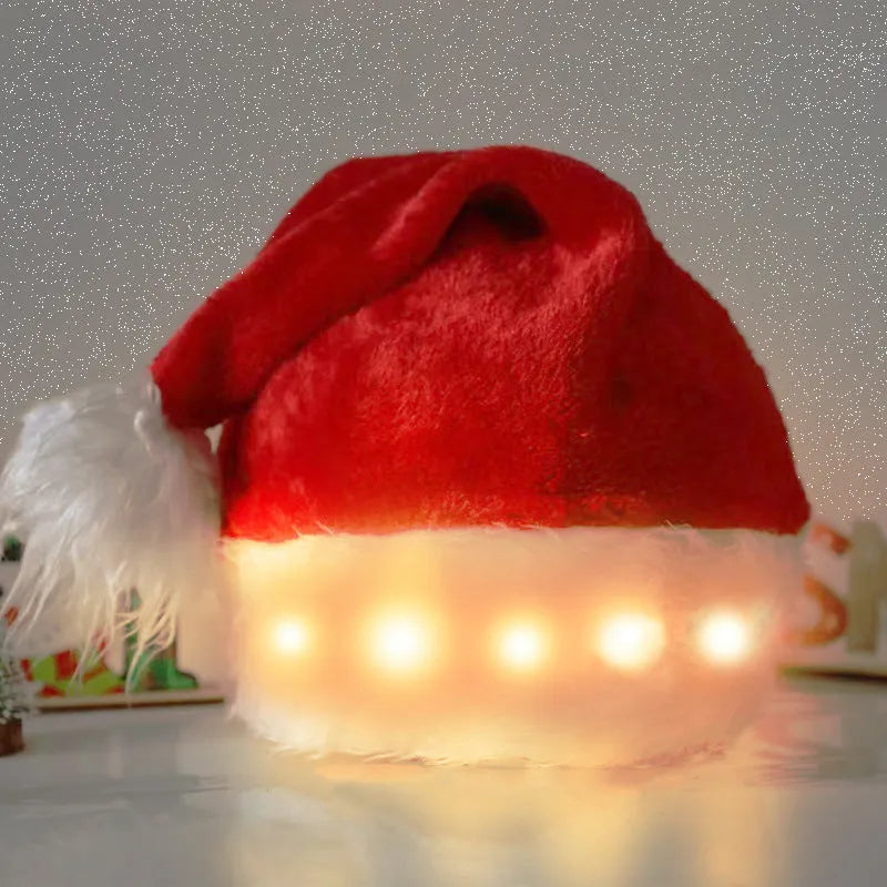 Red and white plush Santa hat with glowing LED lights and a white pom-pom, shown on a person's head.