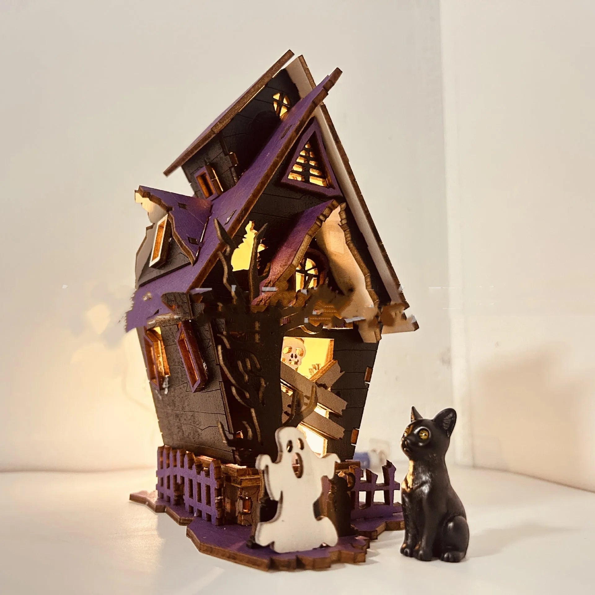 Wooden Halloween haunted house table decoration with candlestick design measuring 14x10.5x19cm