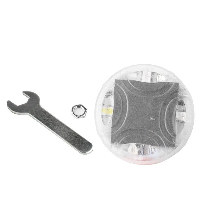 Colourful solar-powered LED valve light for mounting on a car or motorcycle wheel hub.