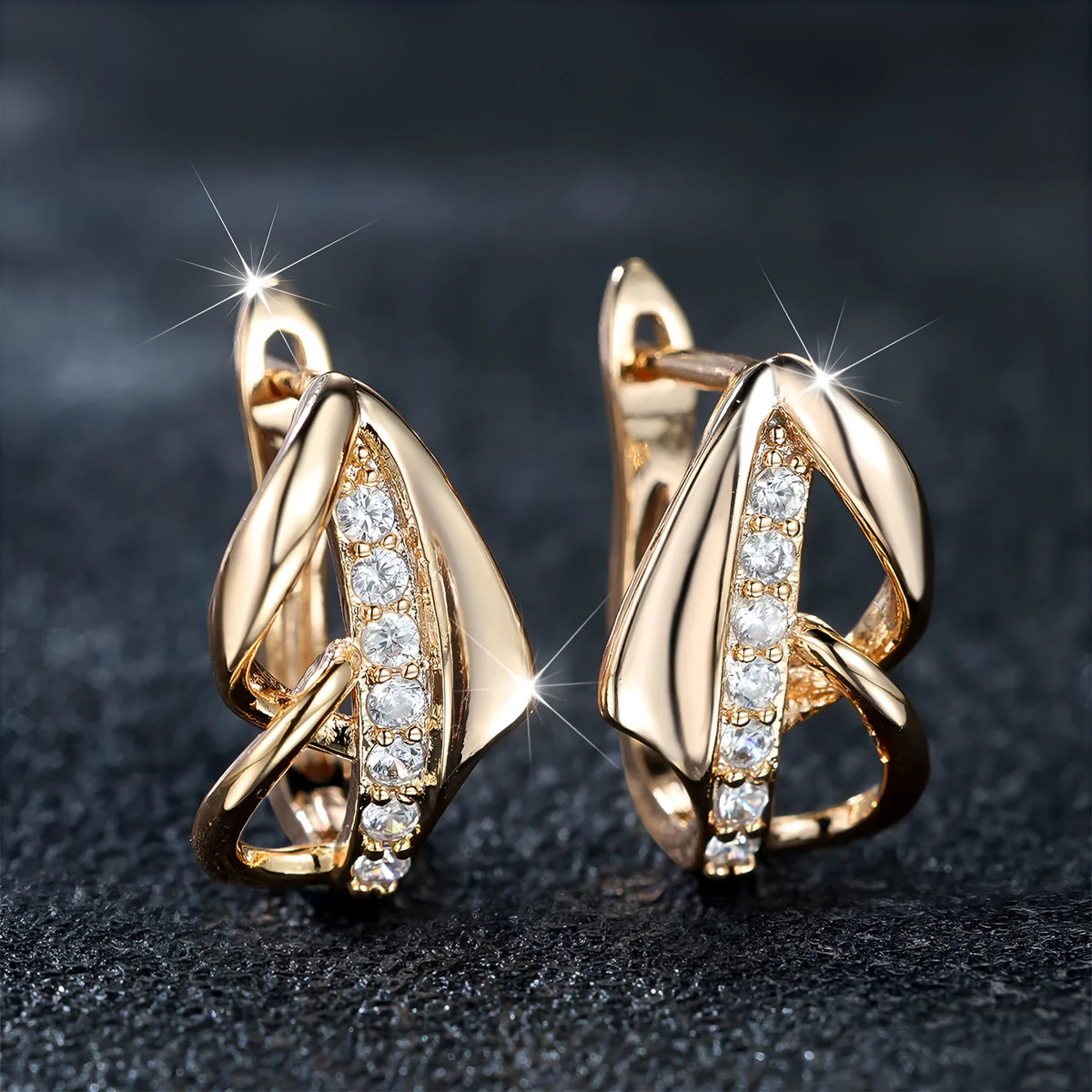 Champagne gold copper ear clip with white diamond centre, geometric arrow shape