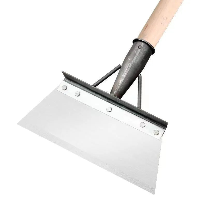 Manganese steel cleaning shovel with a long handle, shown in a garden setting.