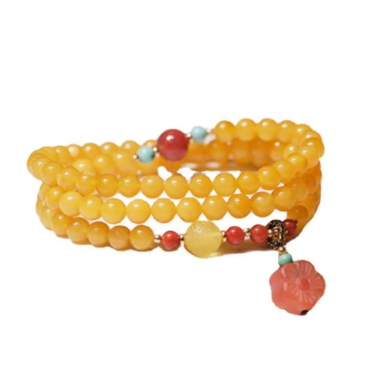 Amber bracelet with carved chicken zodiac charm and 5mm round fantasy crystal elements in retro style