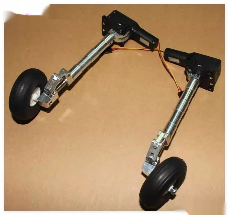 Alloy shock-absorbing retractable landing gear for a drone with alloy wheels.