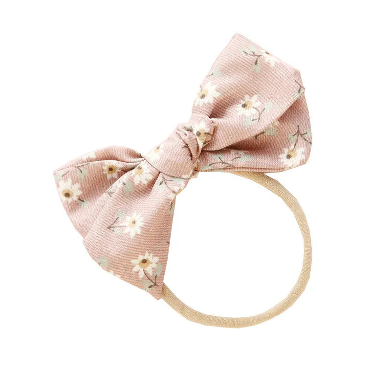Children's cloth hair band with knotted bow design in one of six colour options featuring snow white princess printing