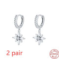 Sterling silver snowflake pendant earrings with geometric design and gemstone accents