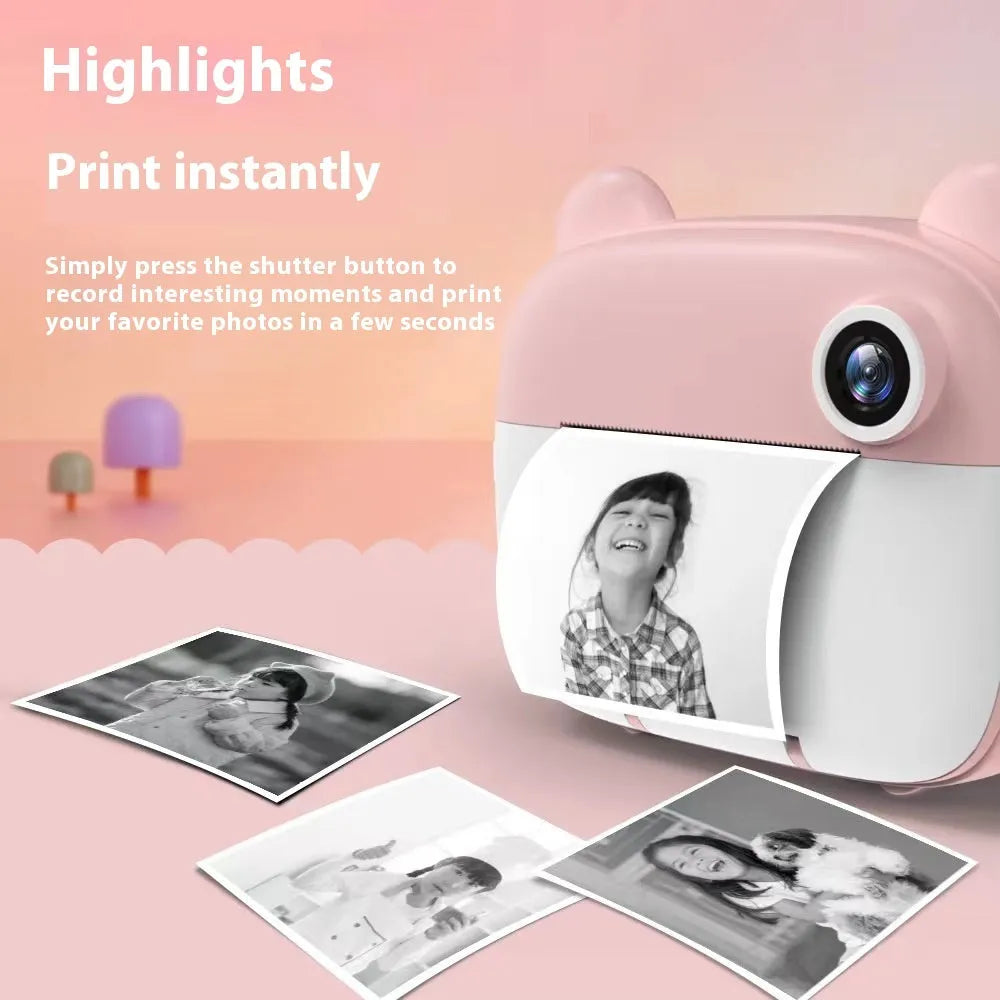 Pink children's SLR-style toy camera with a double lens on a white background.