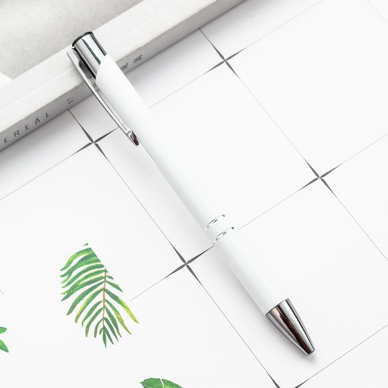 Metal ballpoint pen with push mechanism shown in multiple colour options