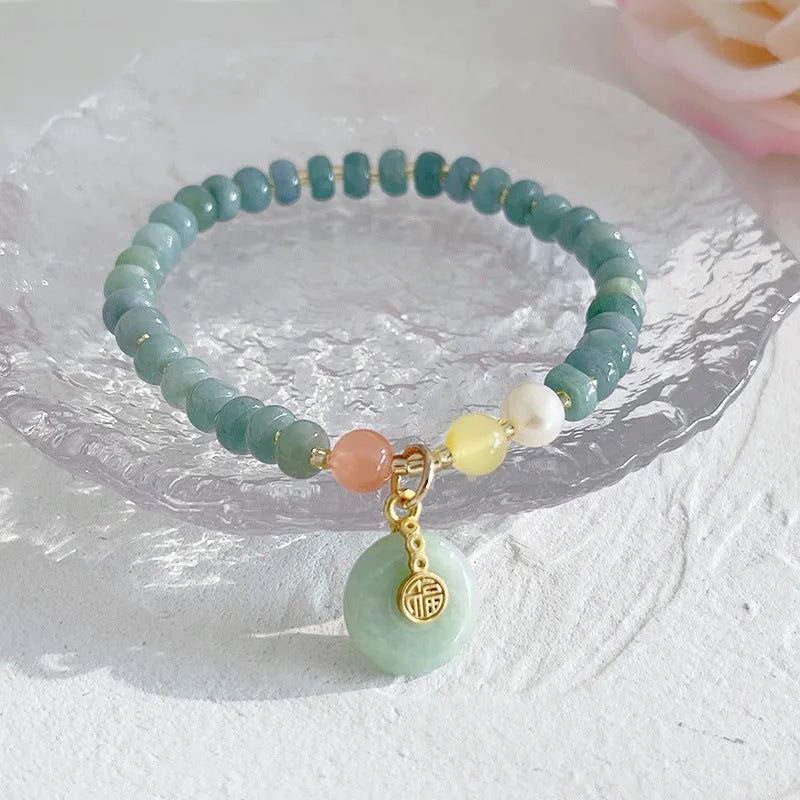 Natural blue water Hetian jade bracelet with carved gourd charm and engraved peace buckle