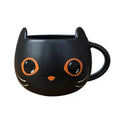 Black ceramic Halloween pumpkin couple mug with 355ml capacity and cat-shaped spoon lid.