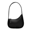 Half moon shaped leather ladies handbag with wide shoulder strap in small size