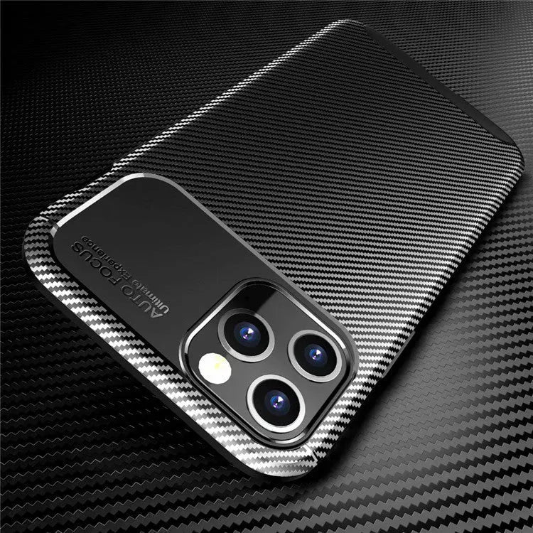 Black silicone protective case for iPhone on a wooden table.