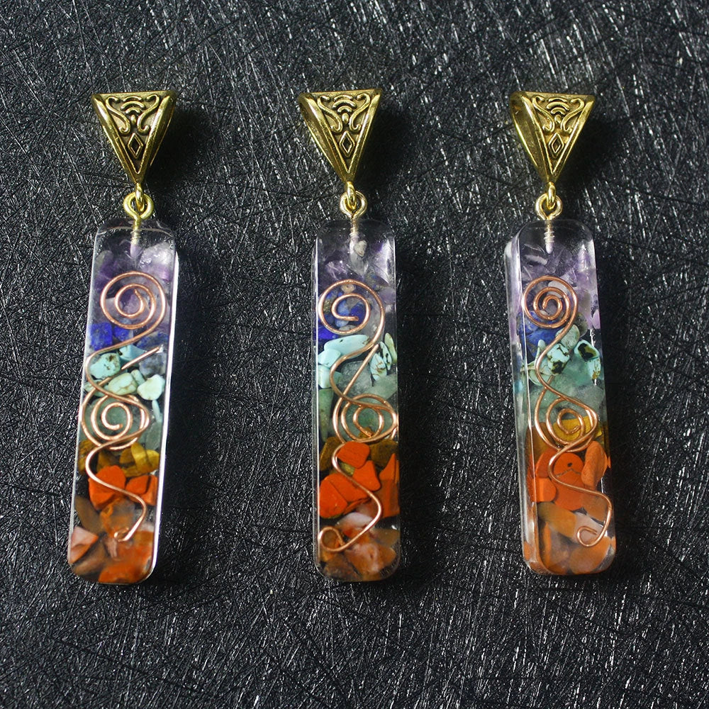 Chakra-inspired acrylic pendant with a unique geometric design and natural variations in the stone patterns