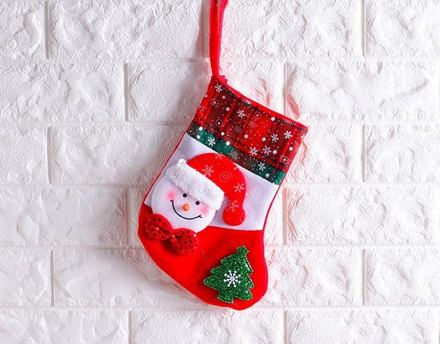 Colorful Christmas ornament-themed socks in a variety of designs, including an elk, bear, elderly person, and snowman.