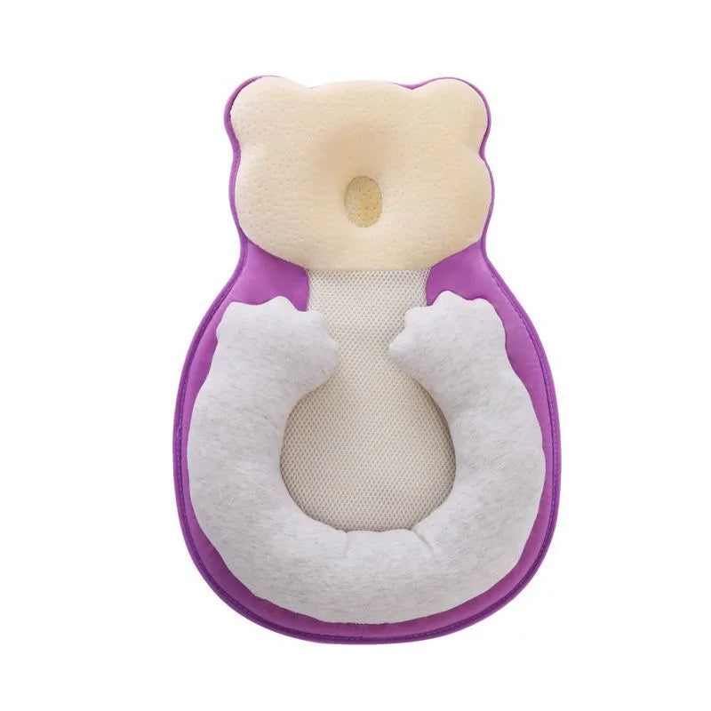 Folded portable baby travel bed with a soft beige cotton sleep cushion for newborns