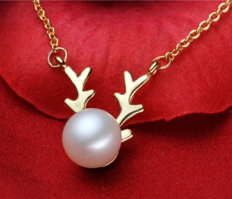 Small elk pearl pendant in copper with gold finish, front view against white background