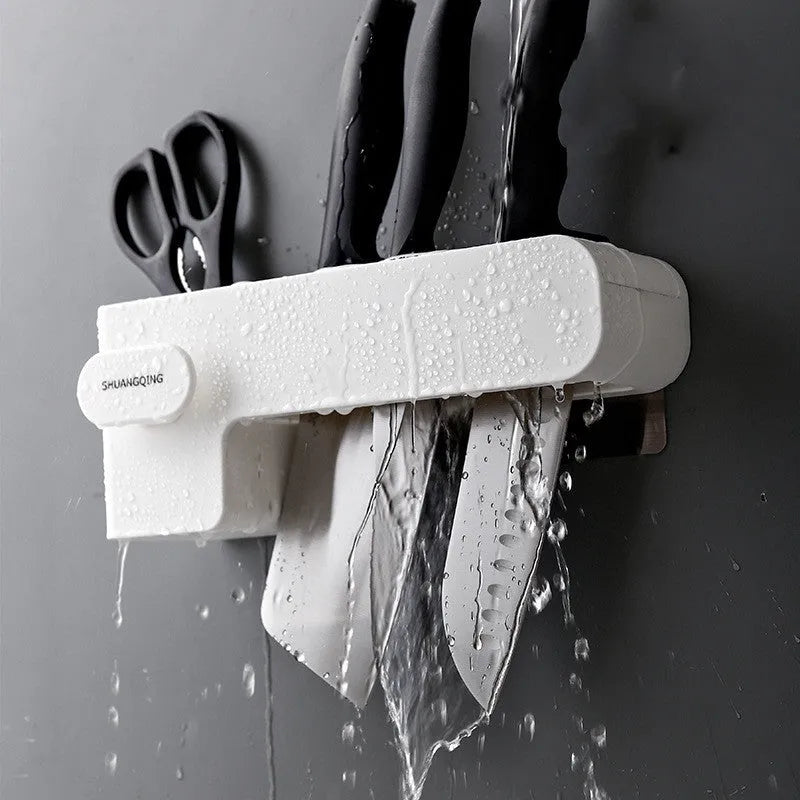 White plastic kitchen knife rack with modern simple design on a countertop