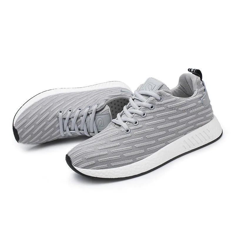 Men Malcolm Sneaker in black from side view showing mesh fabric upper and low-top design