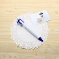 Orange multifunction ballpoint pen with integrated black vernier caliper scale, 15cm long.
