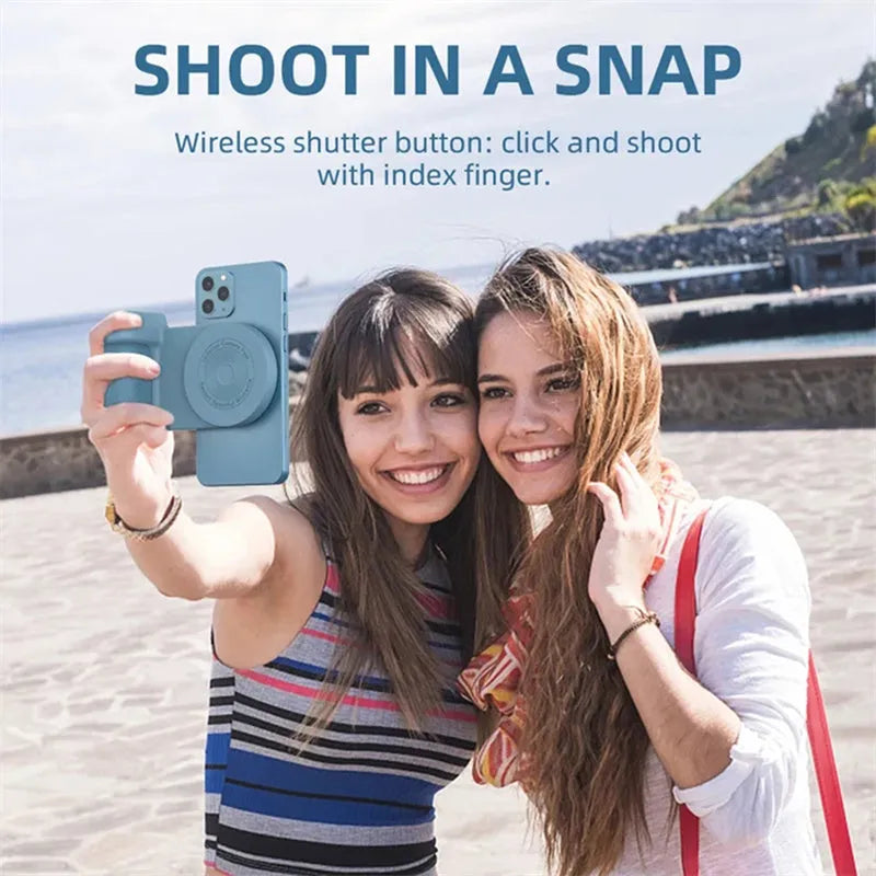Black magnetic phone camera holder with rotatable grip on wooden table demonstrating phone attachment