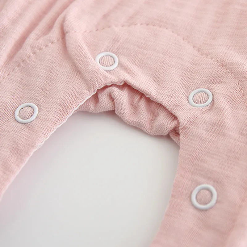 Pink cotton baby girl's long sleeve jumpsuit with single-breasted closure