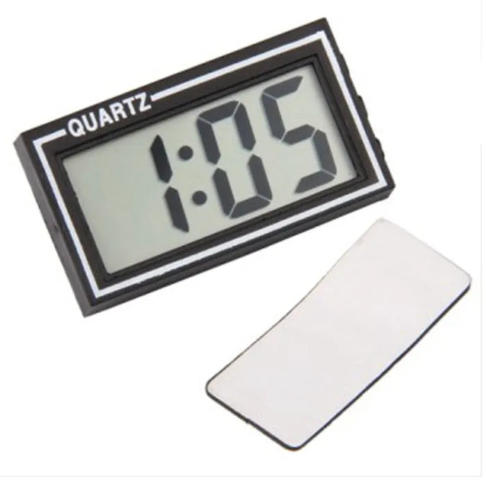 Battery-powered car clock with plastic case and ordinary glass mirror on a dashboard