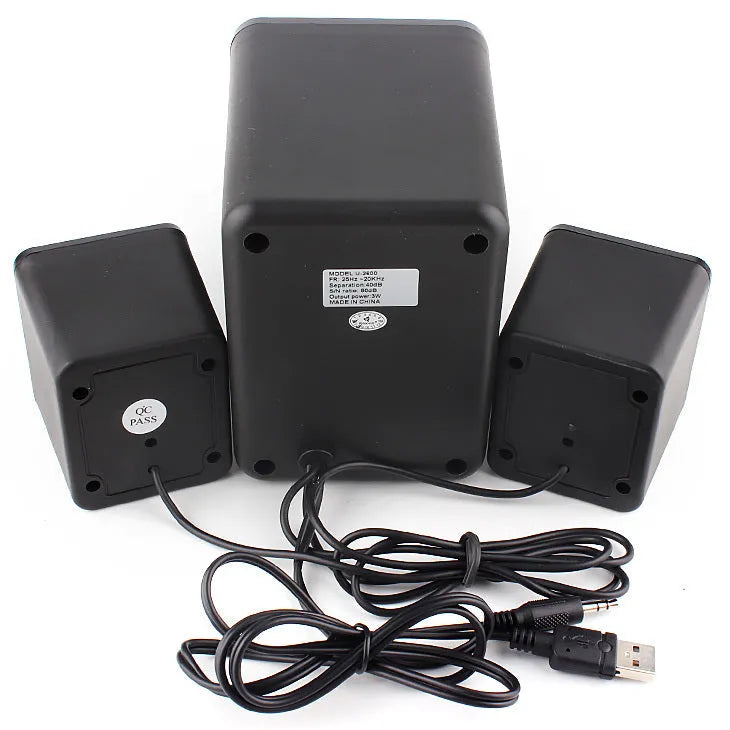 Green USB computer speaker with colourful glowing lights showing USB and 3.5mm ports