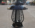 White outdoor solar mosquito lamp with solar panel and LED light beads for garden insect control.