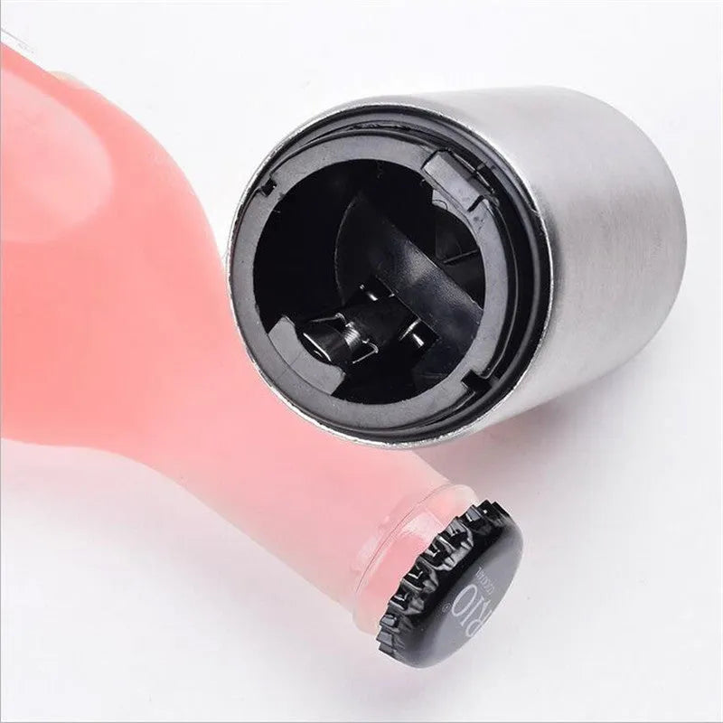 Portable magnetic stainless steel bottle opener with brushed metal finish on countertop