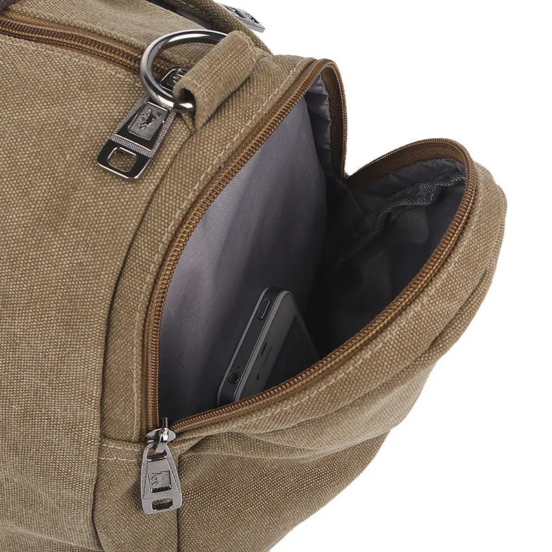 Horizontal square canvas shoulder bag with zipper closure and multiple pockets in khaki colour