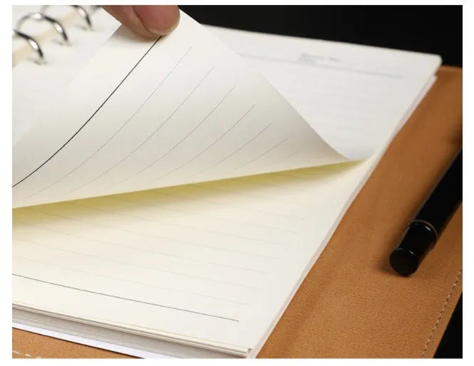 A5 leather notebook with 6-hole binder clip closure and hard cover