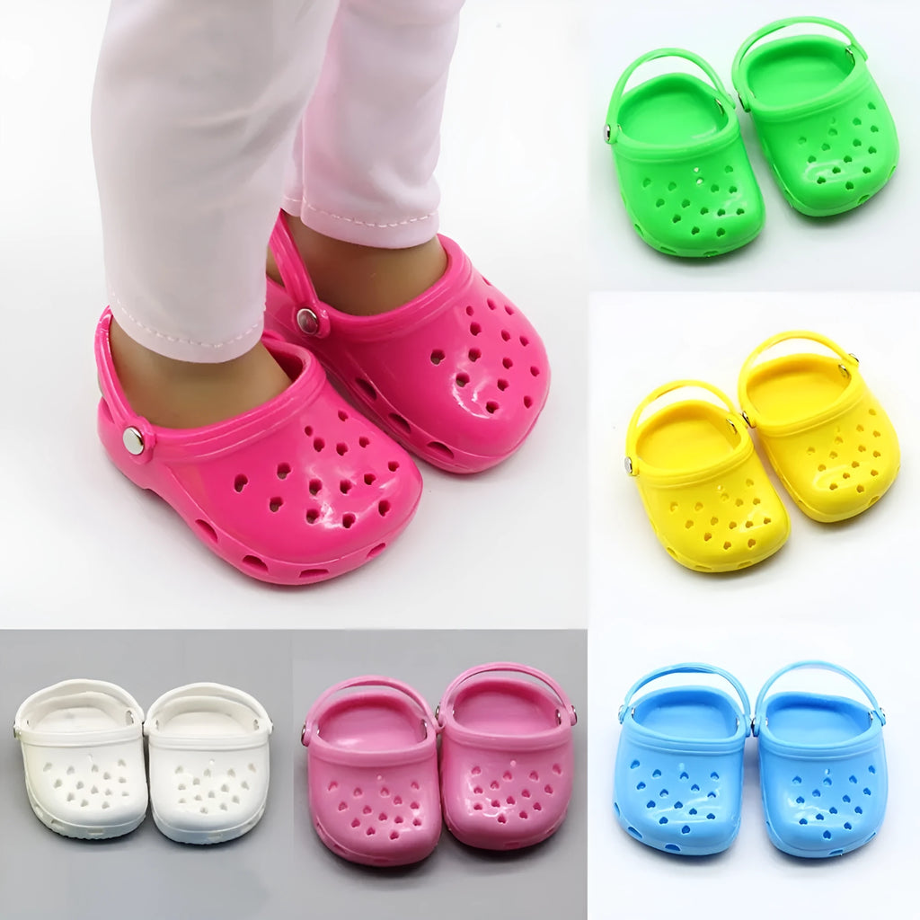 A pair of small plastic doll beach slippers in assorted colours: blue, red, yellow, and green.