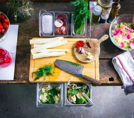 Premium bamboo cutting board with convenient storage trays for chopping, slicing, and dicing ingredients