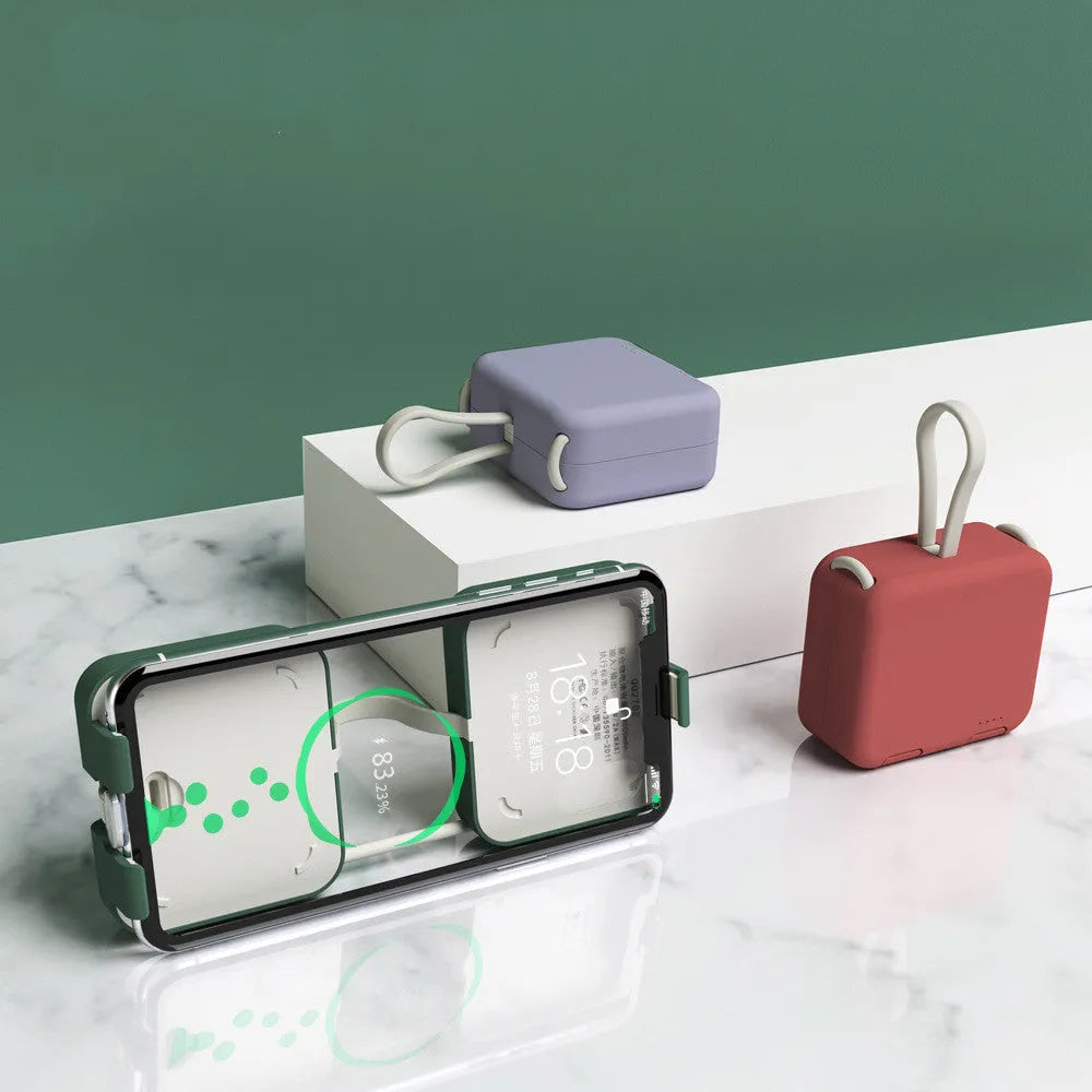 Handbag clip power bank in blue with mobile phone stand function showing charging ports